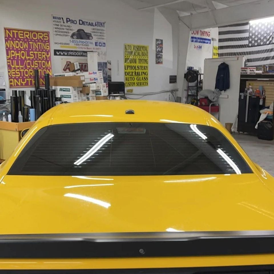 Yellow Dodge Challenger rear window before louver install